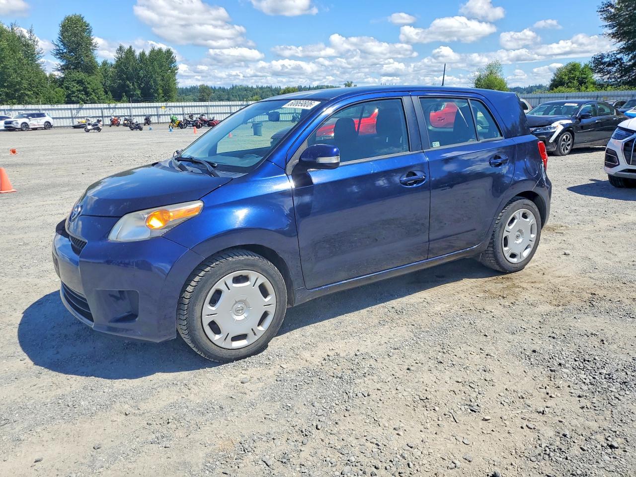 2014 Scion xD, VIN JTKKUPB42E1042282 — Side