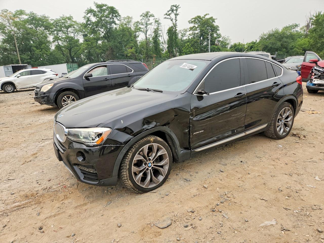 2015 BMW X4 xDrive35i, VIN 5UXXW5C56F0E87099 — Front end