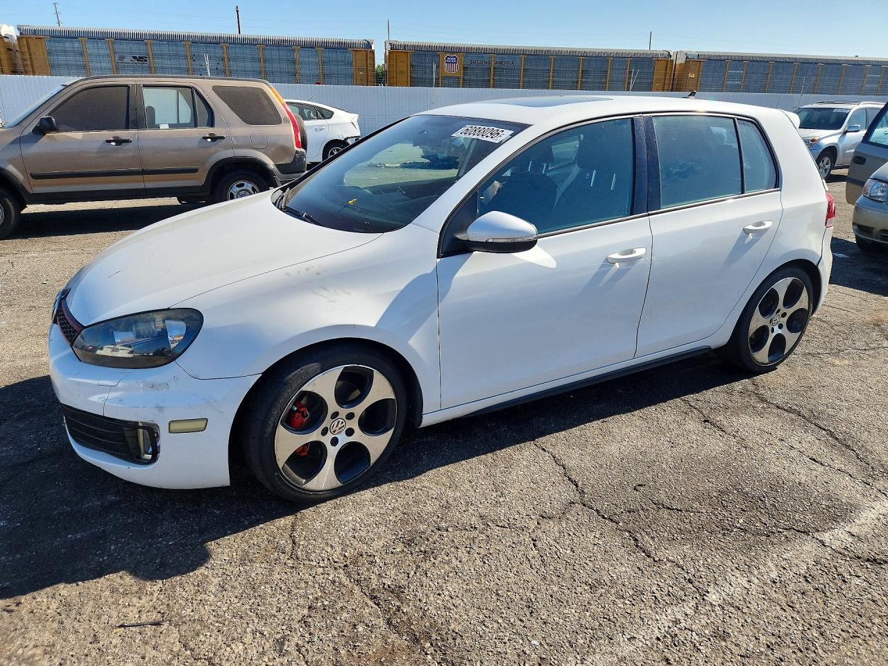 2012 Volkswagen Golf GTI PZEV, VIN WVWGD7AJ9CW015195 — Side