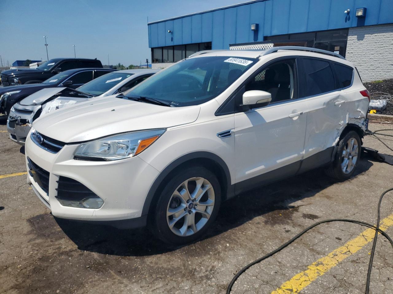 2016 Ford Escape Titanium, VIN 1FMCU9J98GUC09830 — Side