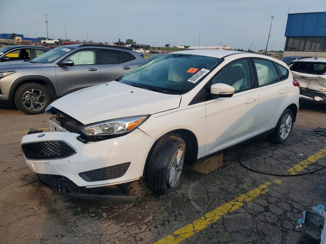 2017 Ford Focus SE, VIN 1FADP3K23HL318353 — Side