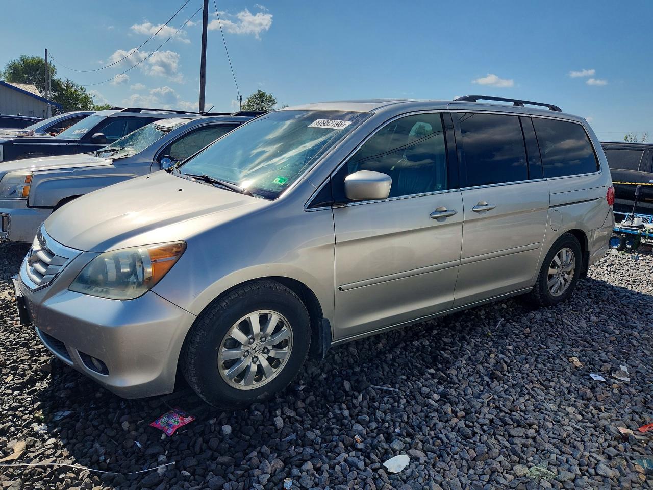 2009 Honda Odyssey EX-L, VIN 5FNRL387X9B041672 — Minor dents and scratches