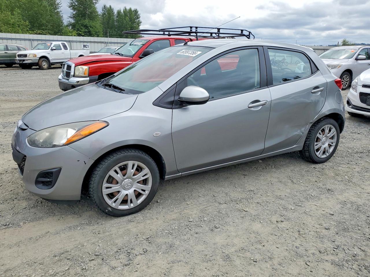 2013 Mazda 2 Sport, VIN JM1DE1KZ7D0167904 — Side