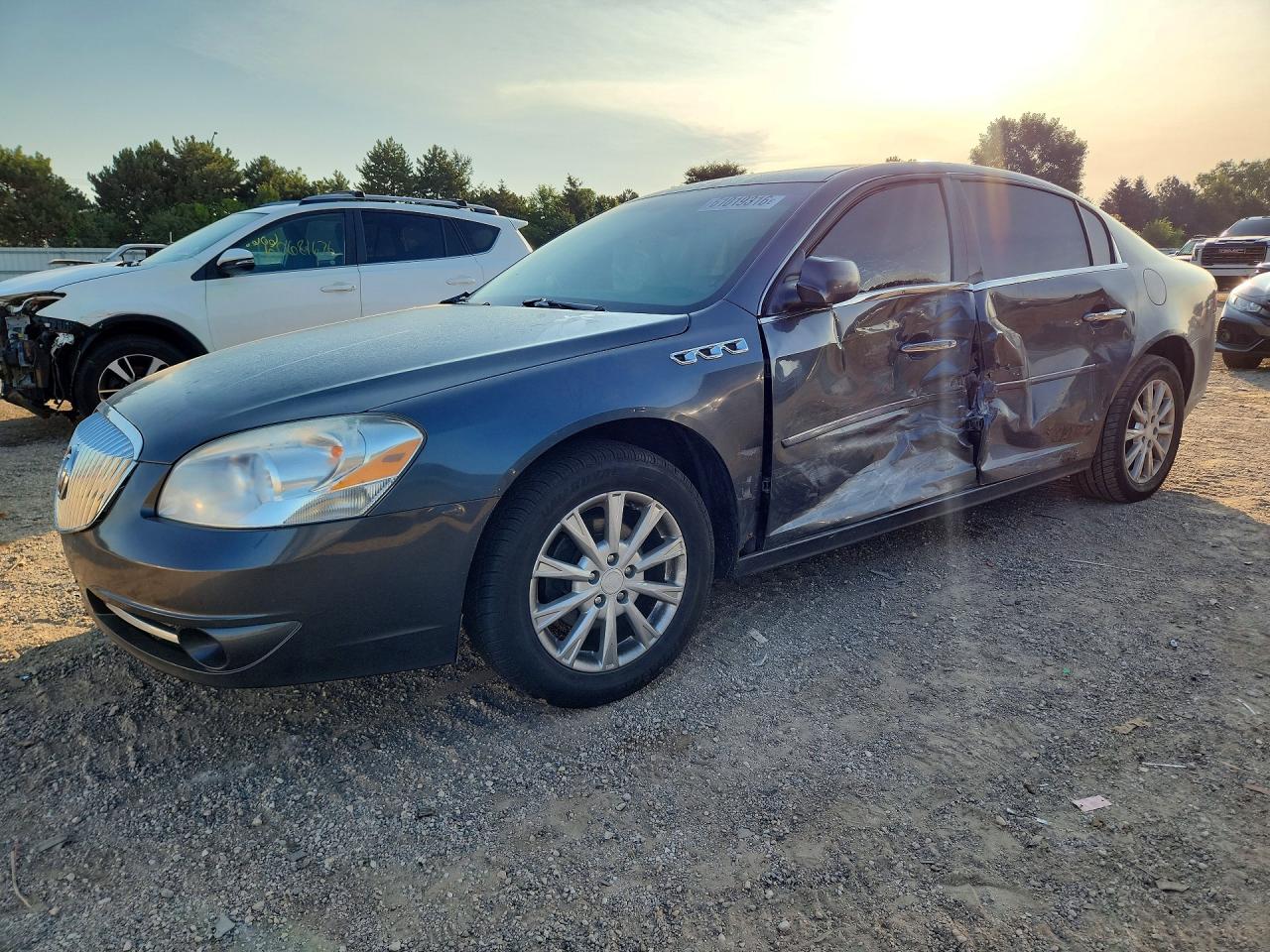 2011 Buick Lucerne CXL, VIN 1G4HC5EM5BU145545 — Side