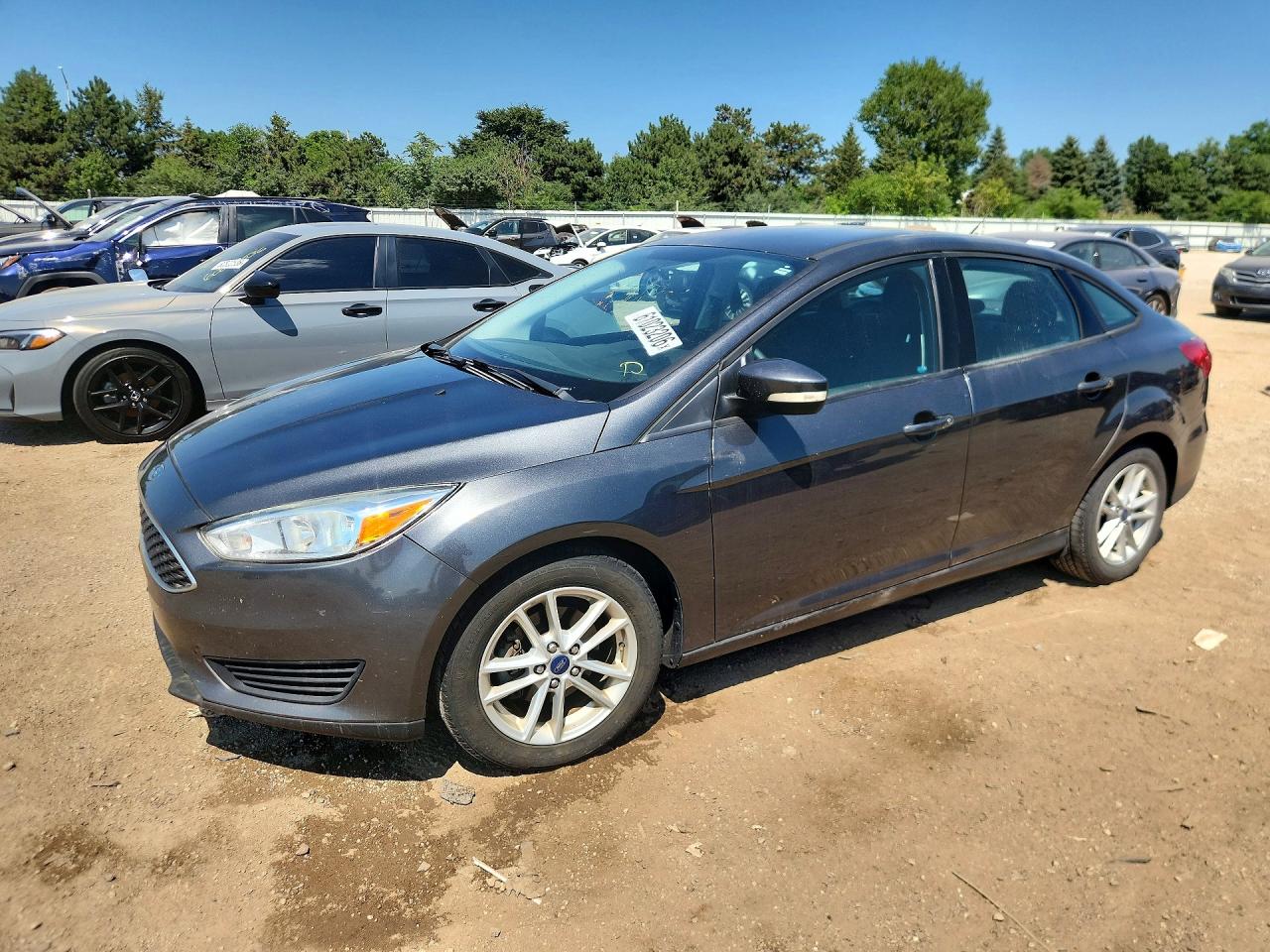 2017 Ford Focus SE, VIN 1FADP3F28HL315992 — Side