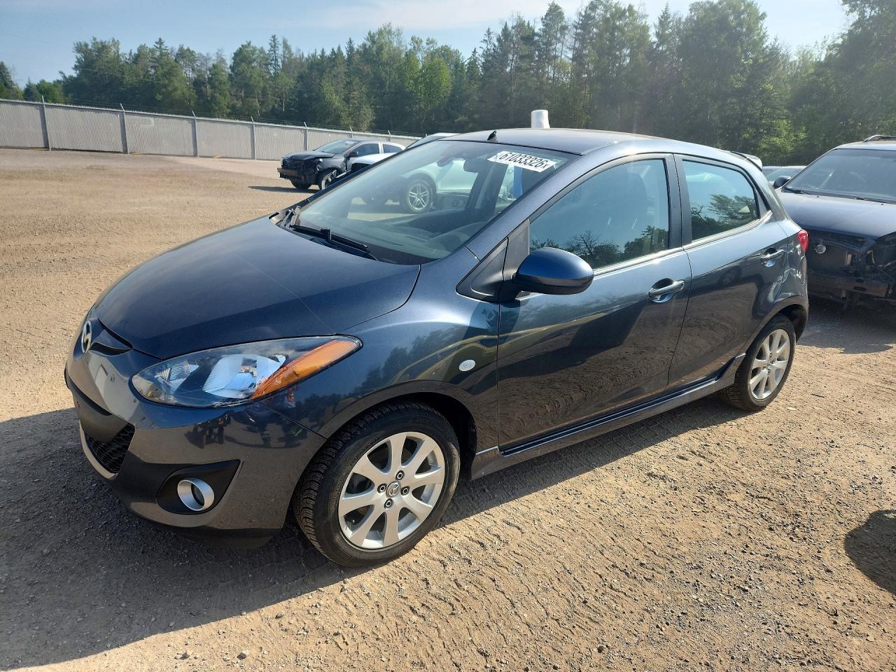 2011 Mazda 2 Touring, VIN JM1DE1HY3B0110725 — Rear end