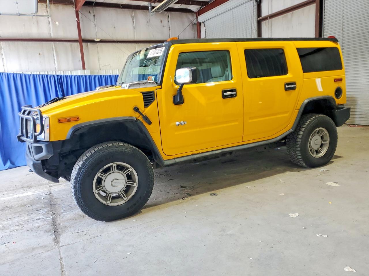 2003 Hummer H2, VIN 5GRGN23U83H141588 — Rear end