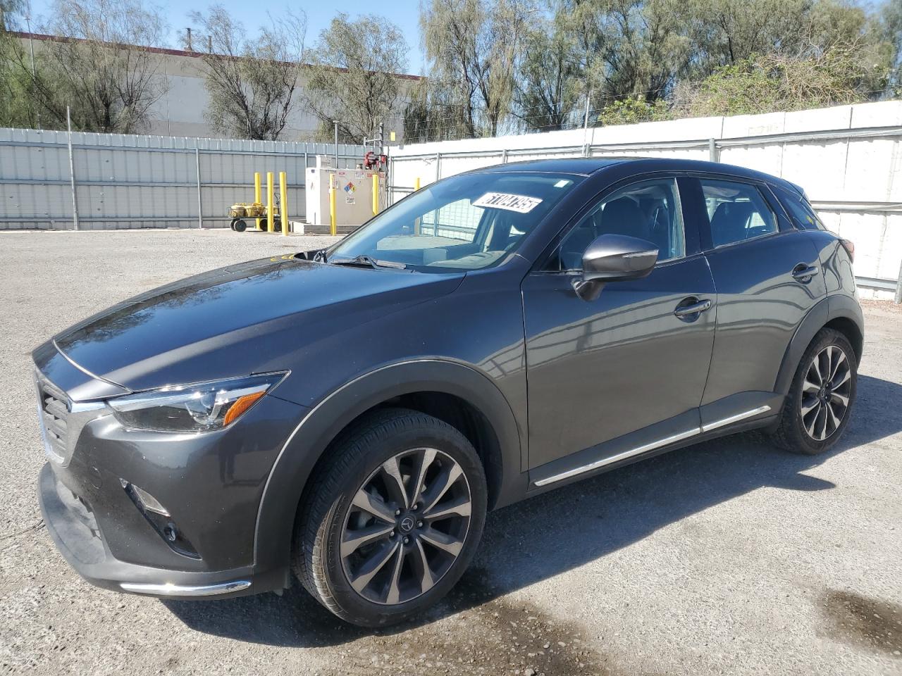 2019 Mazda CX-3 Grand Touring, VIN JM1DKDD73K1400965 — Side