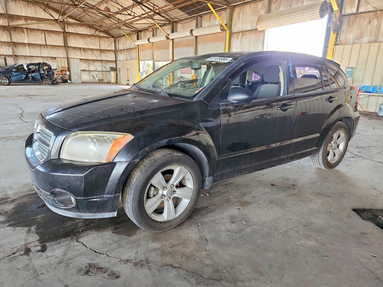 2010 Dodge Caliber Mainstreet, VIN 1B3CB3HA1AD581798 — Side