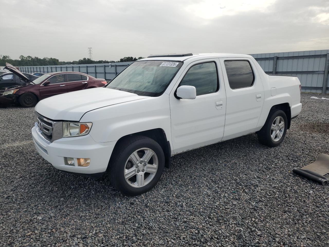 2011 Honda Ridgeline RTL, VIN 5FPYK1F57BB454103 — Днище