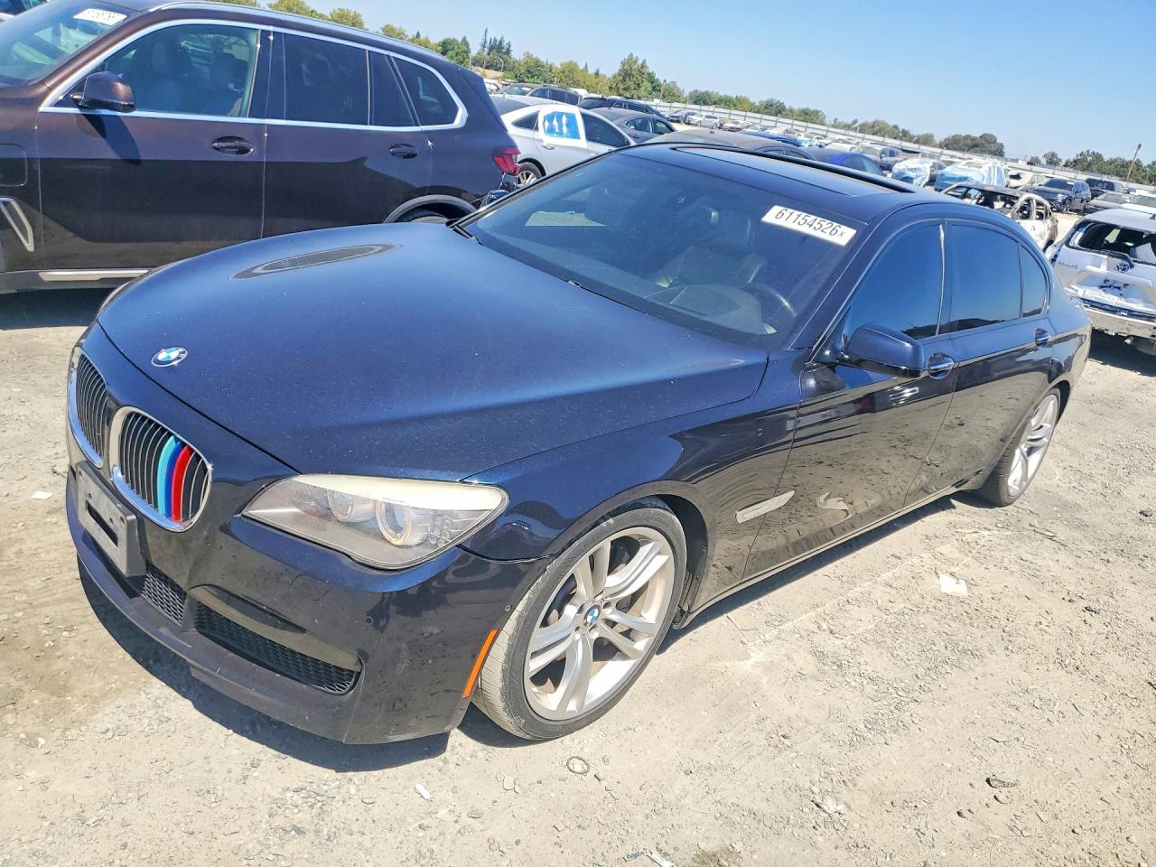2011 BMW 7 Series 750Li, VIN WBAKB8C58BC851647 — Minor dents and scratches