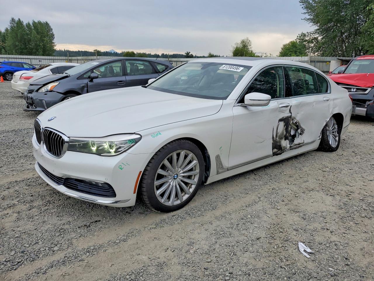 2016 BMW 7 Series 740i, VIN WBA7E2C53GG504155 — Side