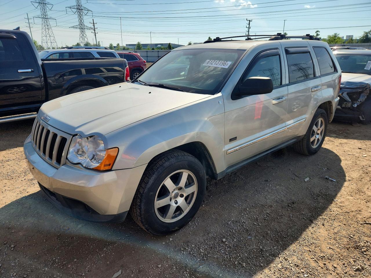 2009 Jeep Grand Cherokee Laredo, VIN 1J8GR48K69C555542 — Minor dents and scratches