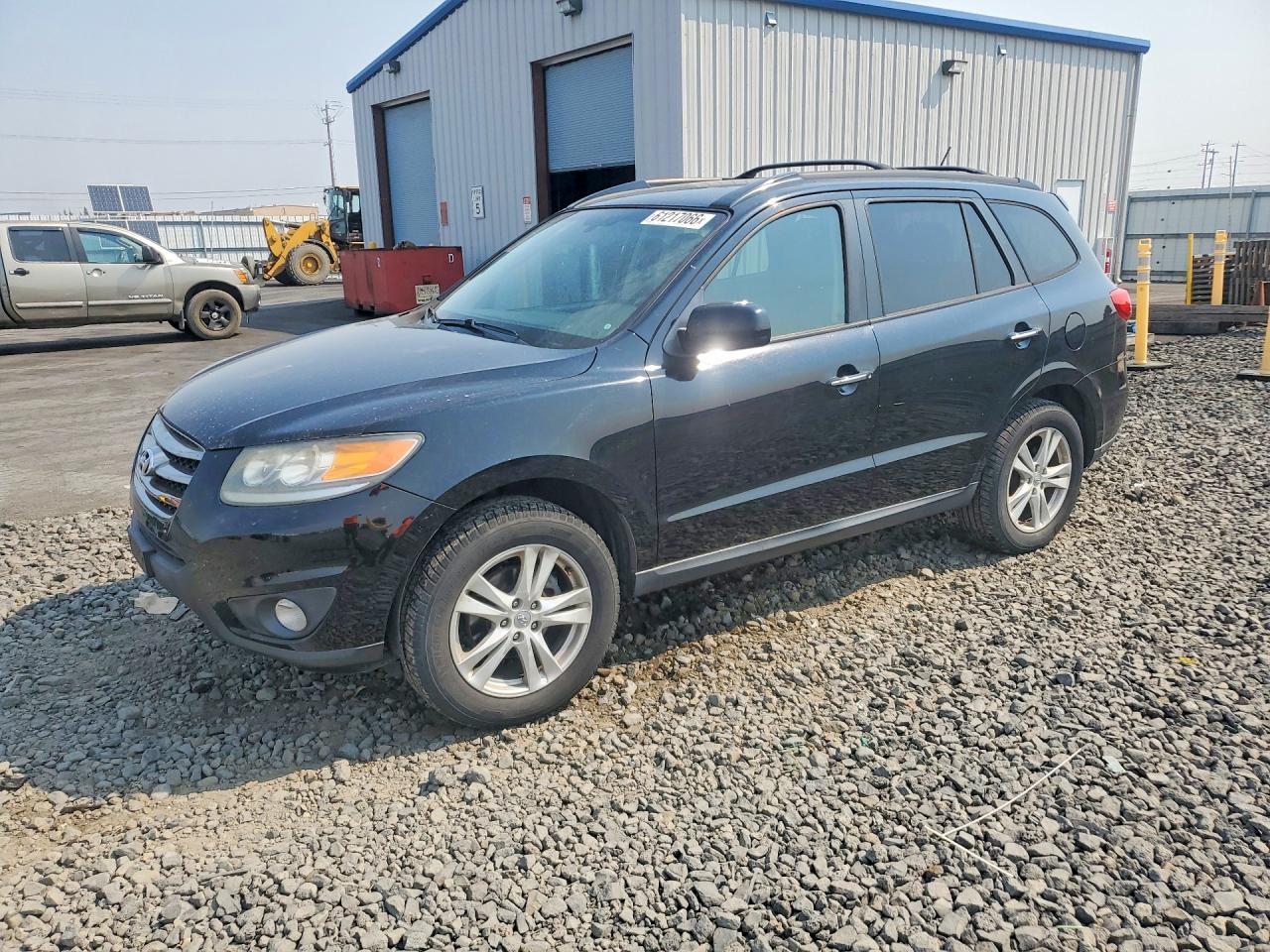 2012 Hyundai Santa Fe Limited, VIN 5XYZKDAGXCG110878 — Side