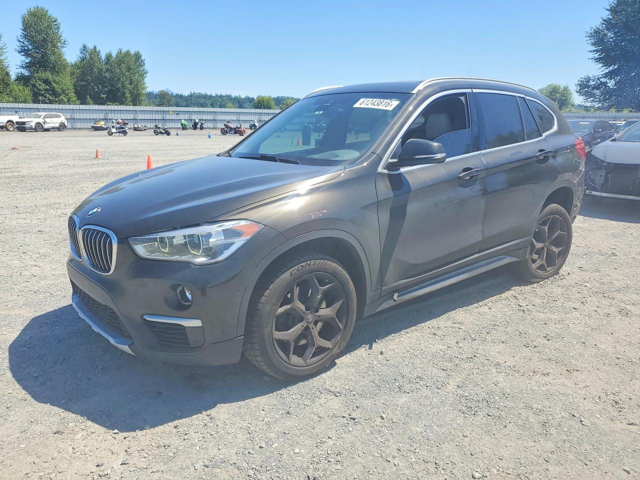 2018 BMW X1 xDrive28i, VIN WBXHT3C3XJ3H30621 — Rear end