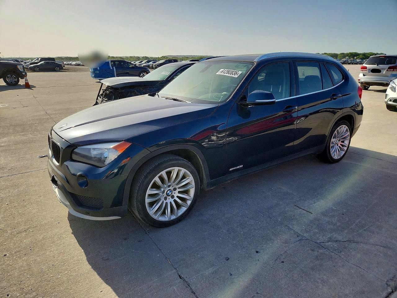 2015 BMW X1 sDrive28i, VIN WBAVM1C52FVZ93761 — Front end