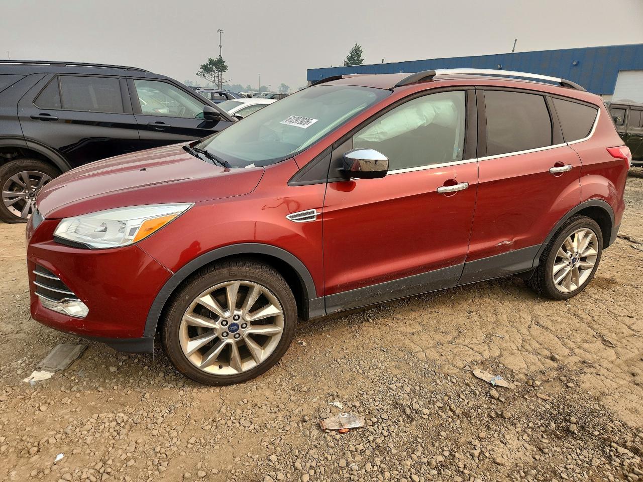 2016 Ford Escape SE, VIN 1FMCU9G9XGUB56328 — Side