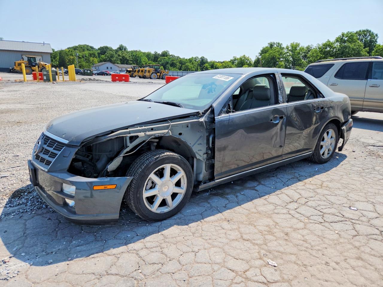 2010 Cadillac STS AWD, VIN 1G6DU6EV5A0113671 — Side