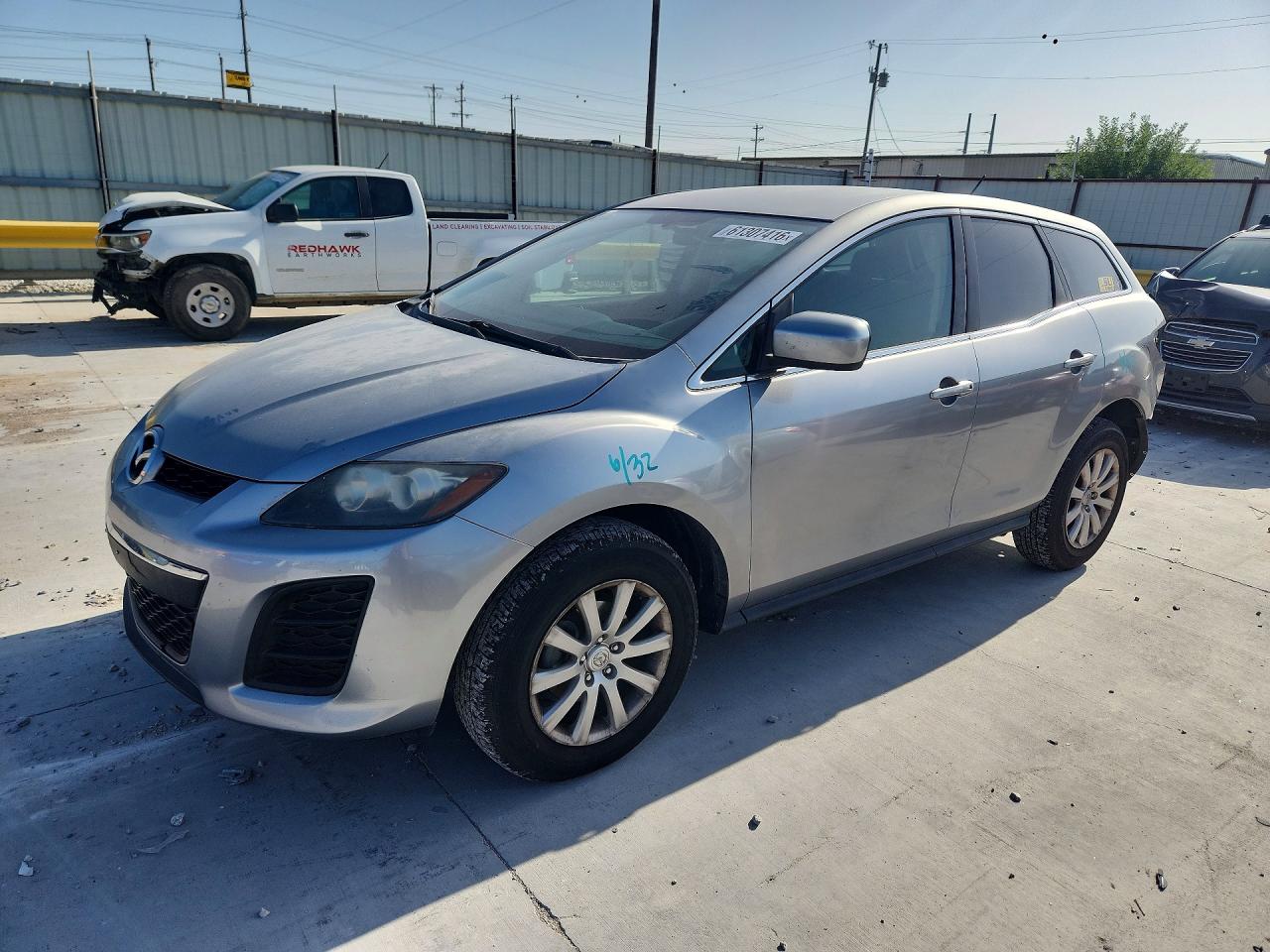 2011 Mazda CX-7 i SV, VIN JM3ER2A54B0394422 — Зад