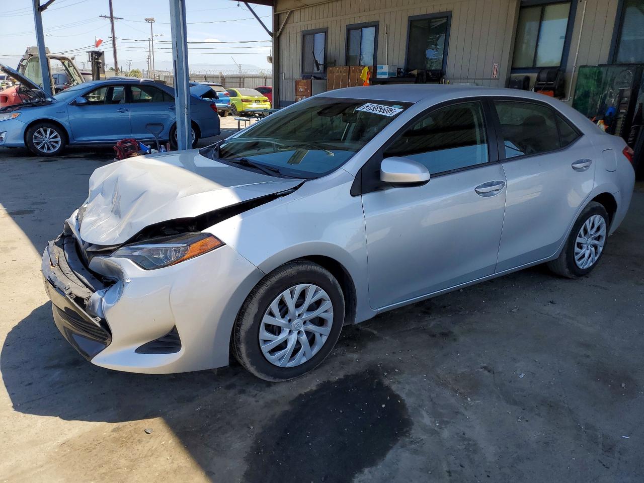 2019 Toyota Corolla LE, VIN 5YFBURHE1KP899512 — Front end