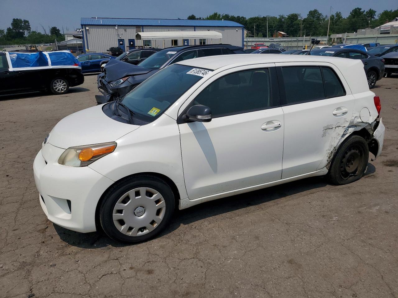 2013 Scion xD, VIN JTKKUPB41D1032891 — Side