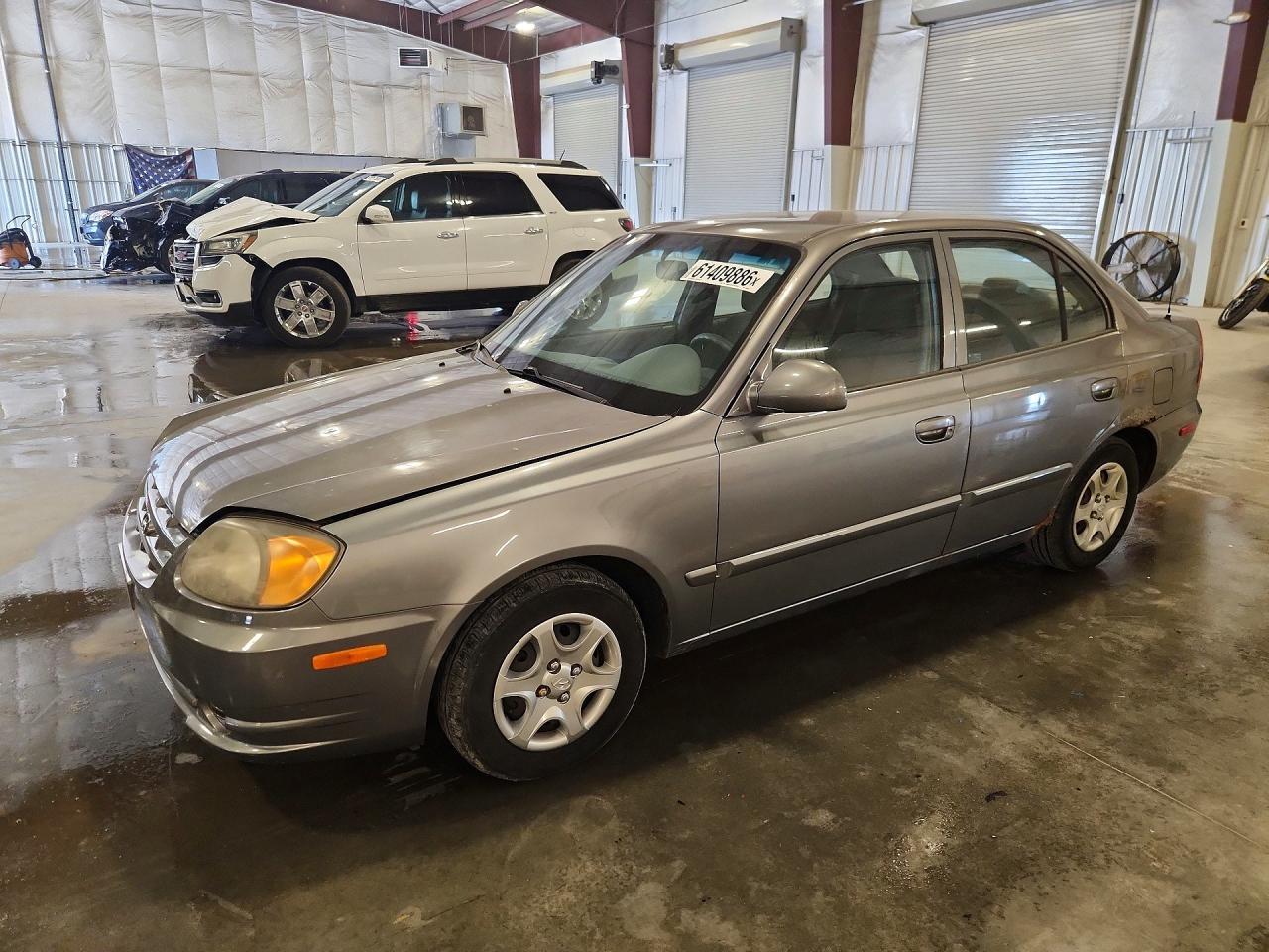 2005 Hyundai Accent GLS, VIN KMHCG45C65U600505 — Град