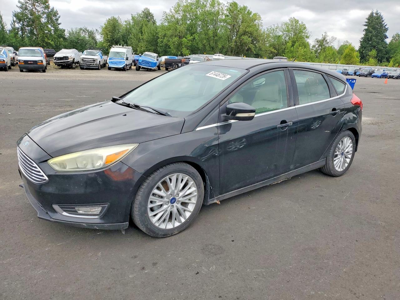 2015 Ford Focus Titanium, VIN 1FADP3N22FL222111 — Minor dents and scratches