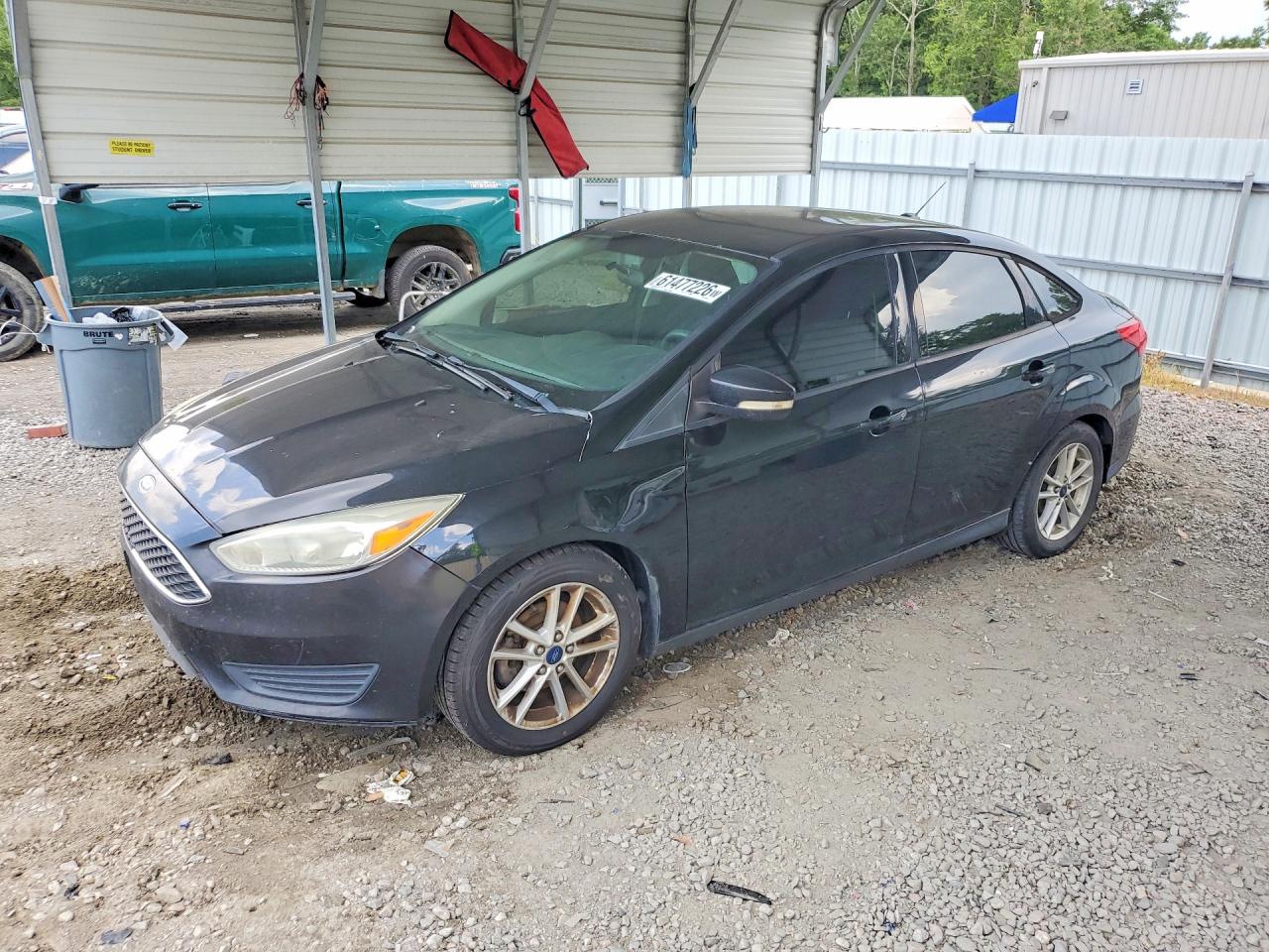 2015 Ford Focus SE, VIN 1FADP3F23FL205459 — Side