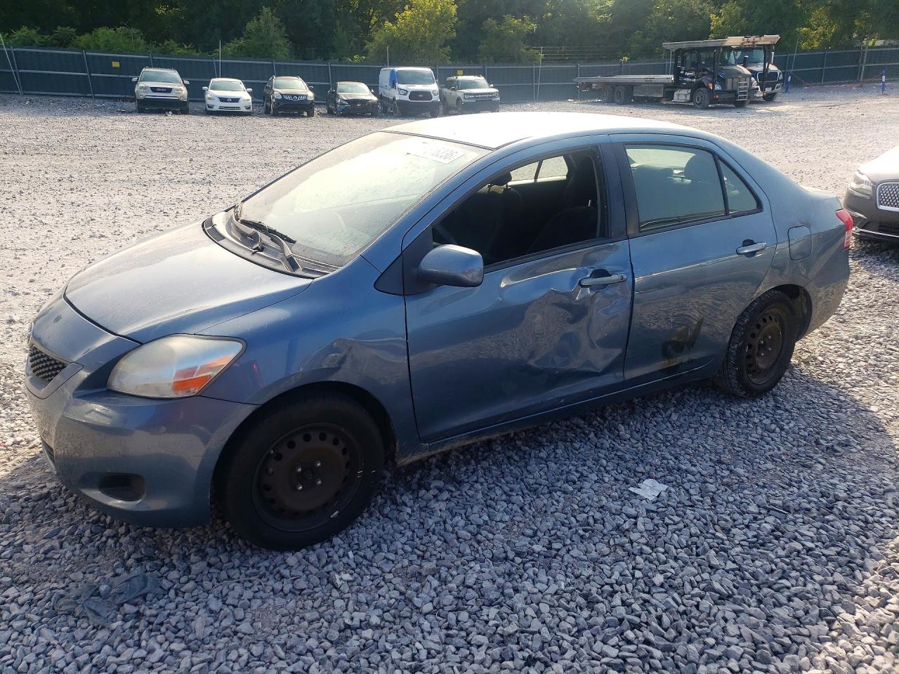 2012 Toyota Yaris, VIN JTDBT4K33CL024293 — Side
