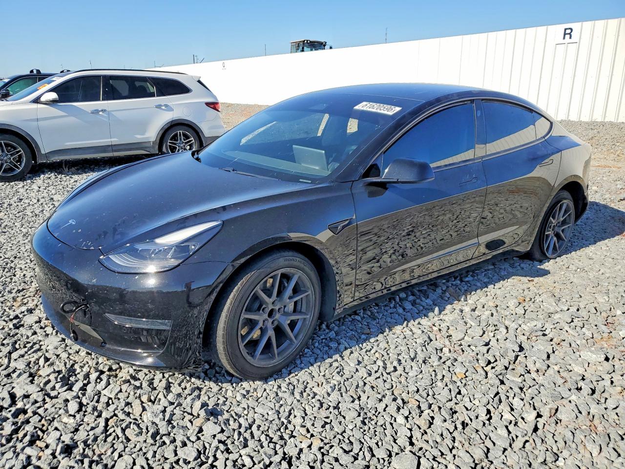 2021 Tesla Model 3 Standard Range Plus, VIN 5YJ3E1EA4MF023035 — Side