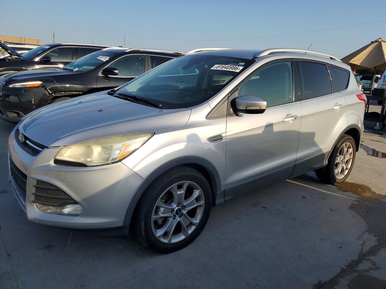 2015 Ford Escape Titanium, VIN 1FMCU0J9XFUA46771 — Side