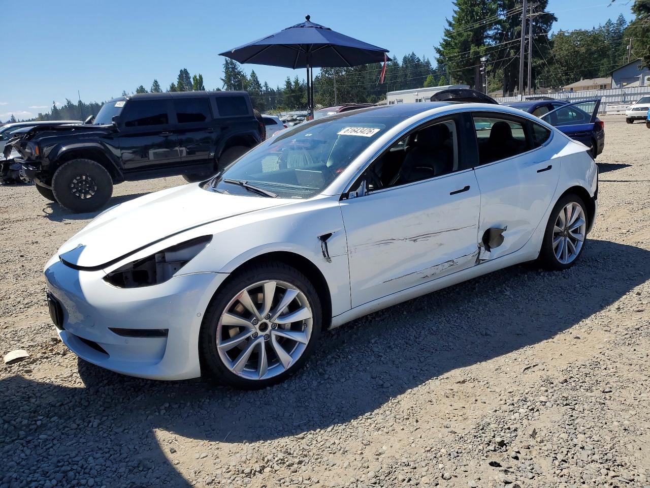 2018 Tesla Model 3 Long Range Battery, VIN 5YJ3E1EB8JF092458 — Side
