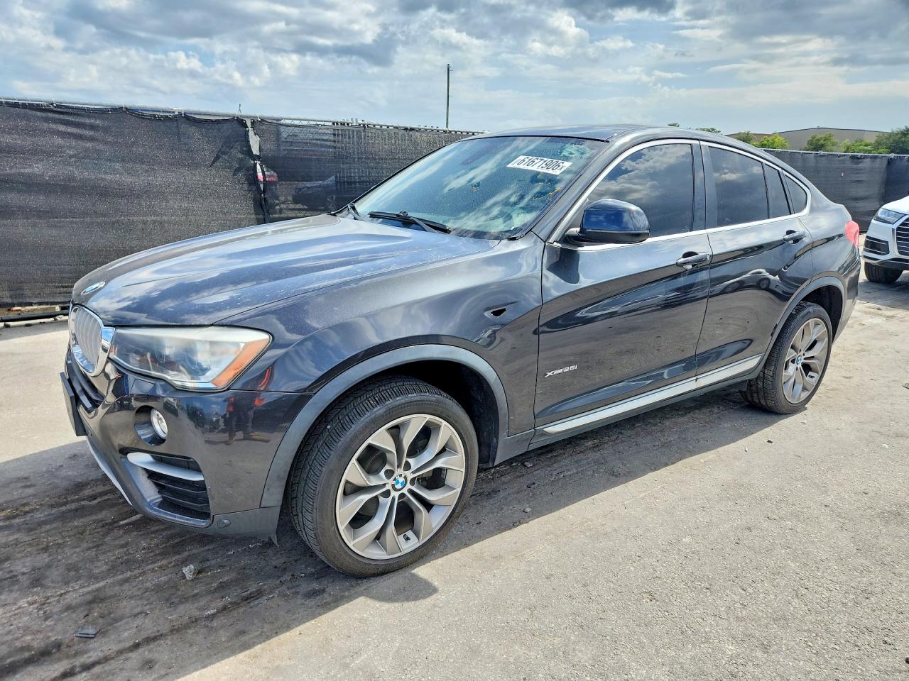 2017 BMW X4 xDrive28i, VIN 5UXXW3C55H0T78038 — Rear end