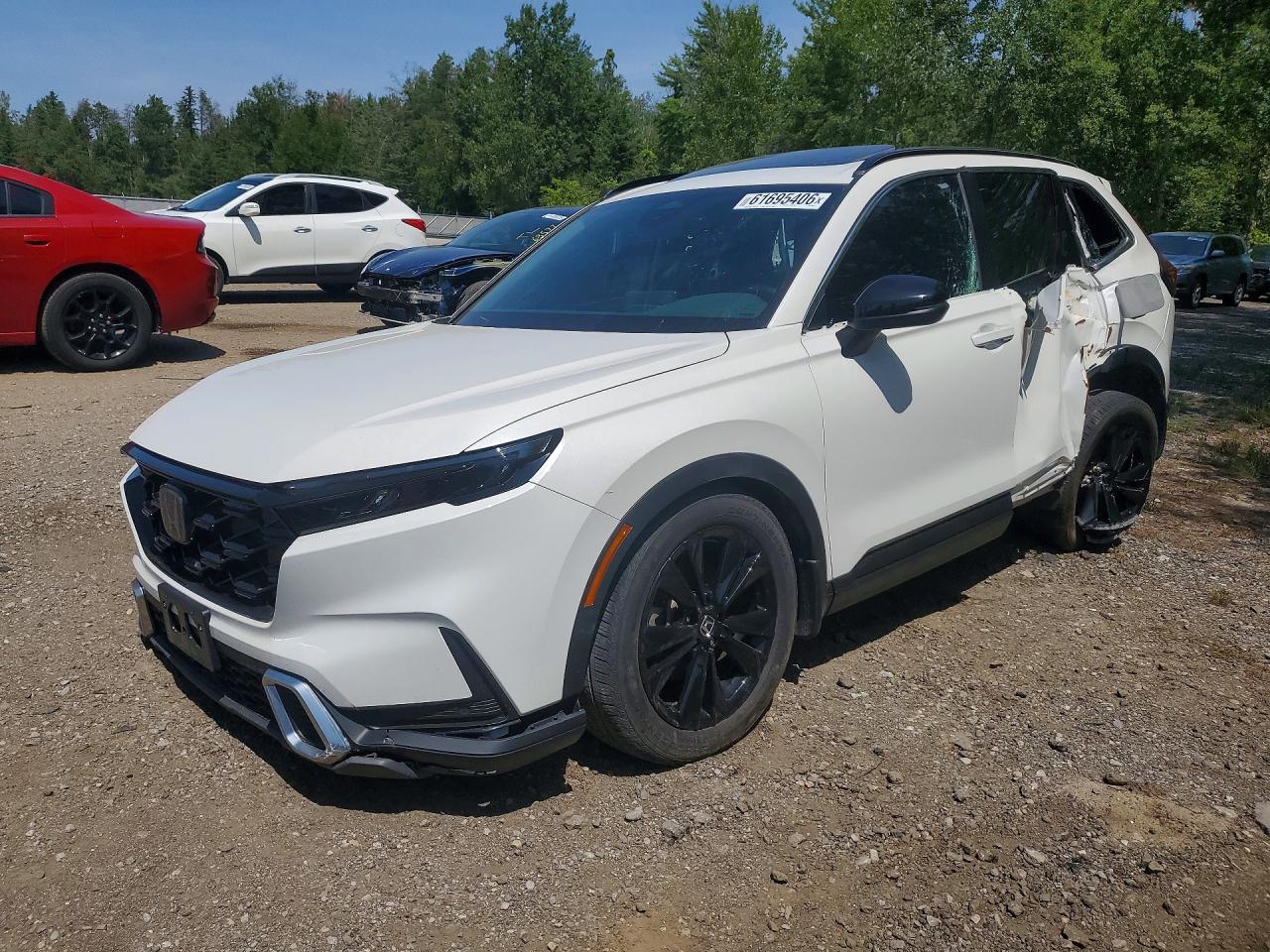 2023 Honda CR-V Sport Touring, VIN 2HKRS6H97PH205111 — Бок