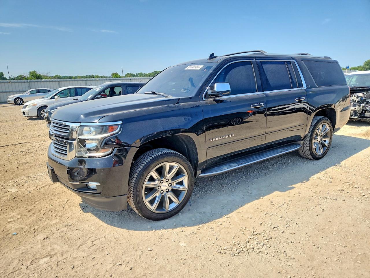 2015 Chevrolet Suburban LTZ, VIN 1GNSCKKCXFR639842 — Front end