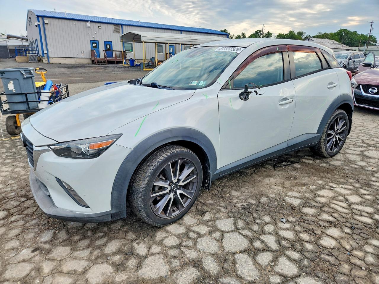 2018 Mazda CX-3 Touring, VIN JM1DKDC79J0304912 — Side