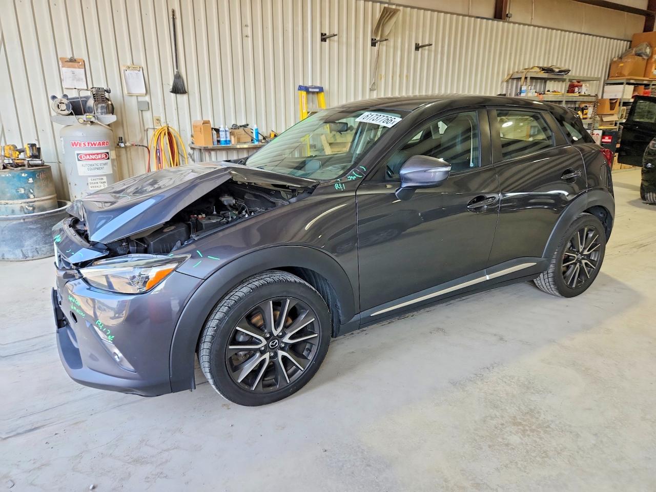 2016 Mazda CX-3 Grand Touring, VIN JM1DKBD73G0113174 — Front end