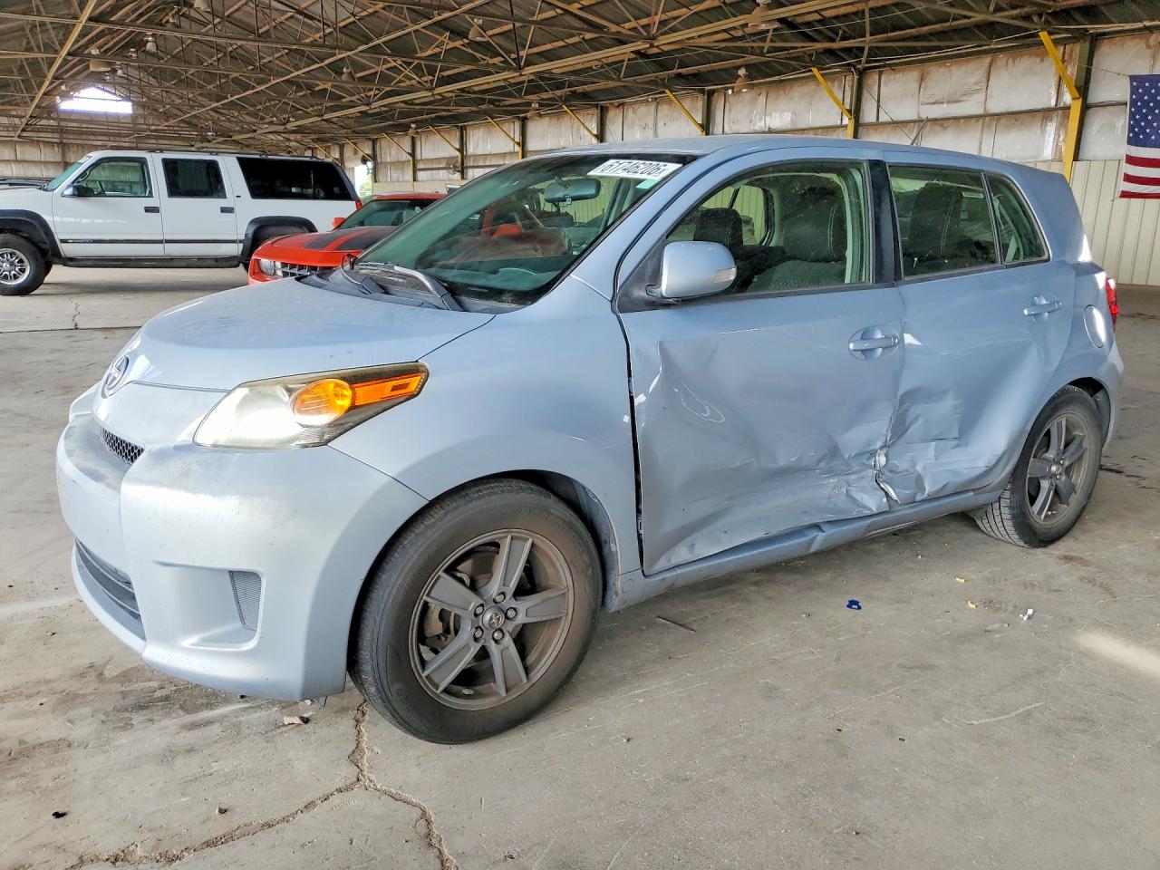 2013 Scion xD, VIN JTKKUPB49D1038356 — Side
