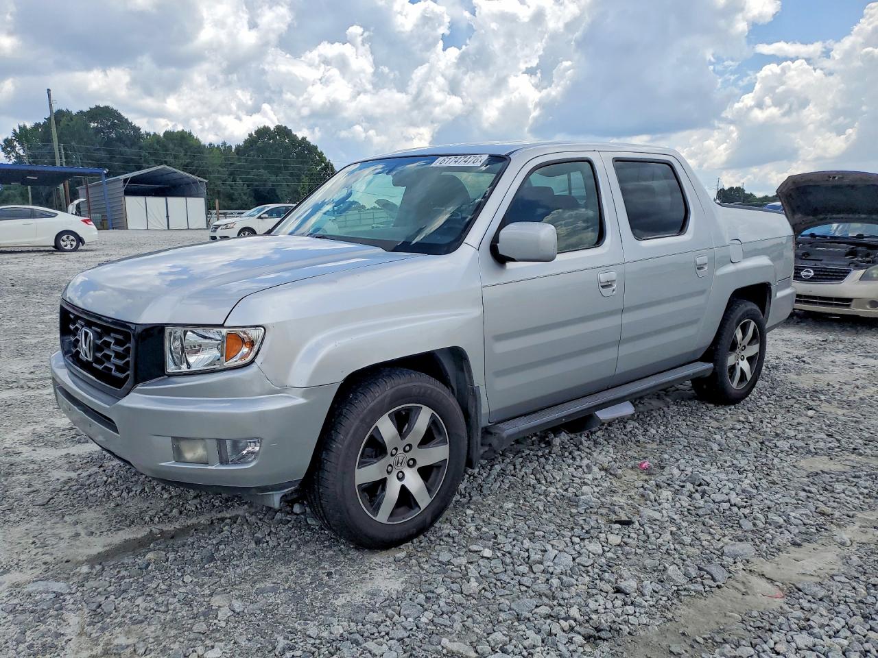 2014 Honda Ridgeline SE, VIN 5FPYK1F61EB007179 — Minor dents and scratches