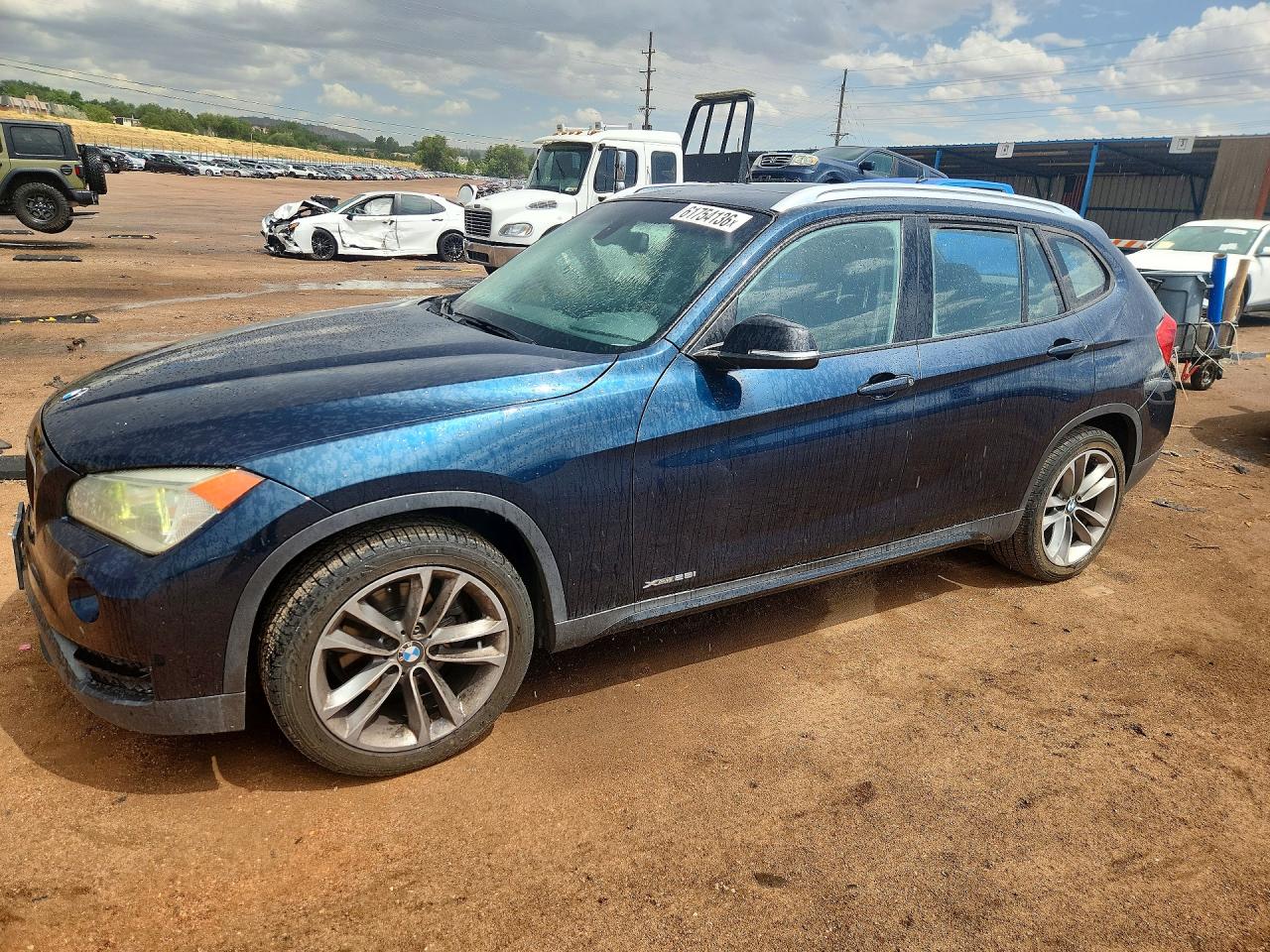 2014 BMW X1 xDrive28i, VIN WBAVL1C5XEVY10950 — Hail