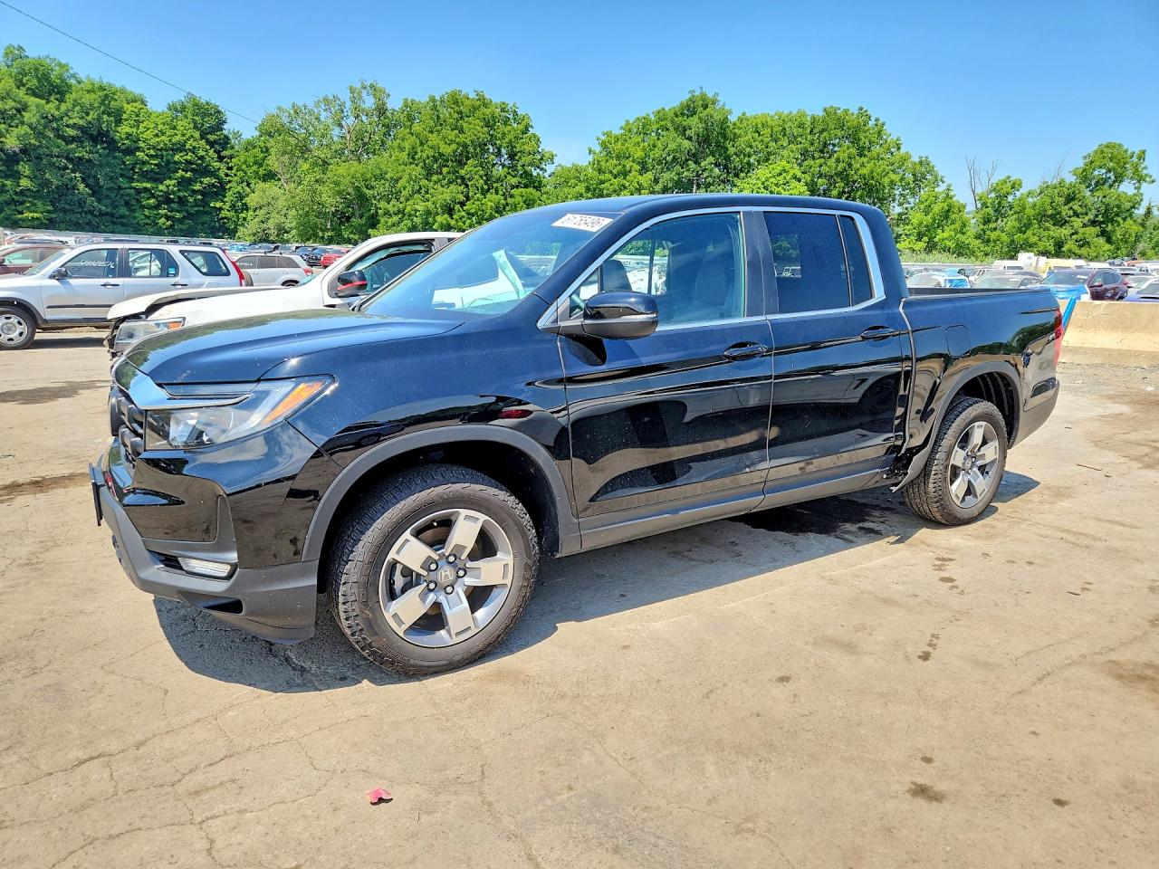 2024 Honda Ridgeline RTL, VIN 5FPYK3F59RB026216 — Side