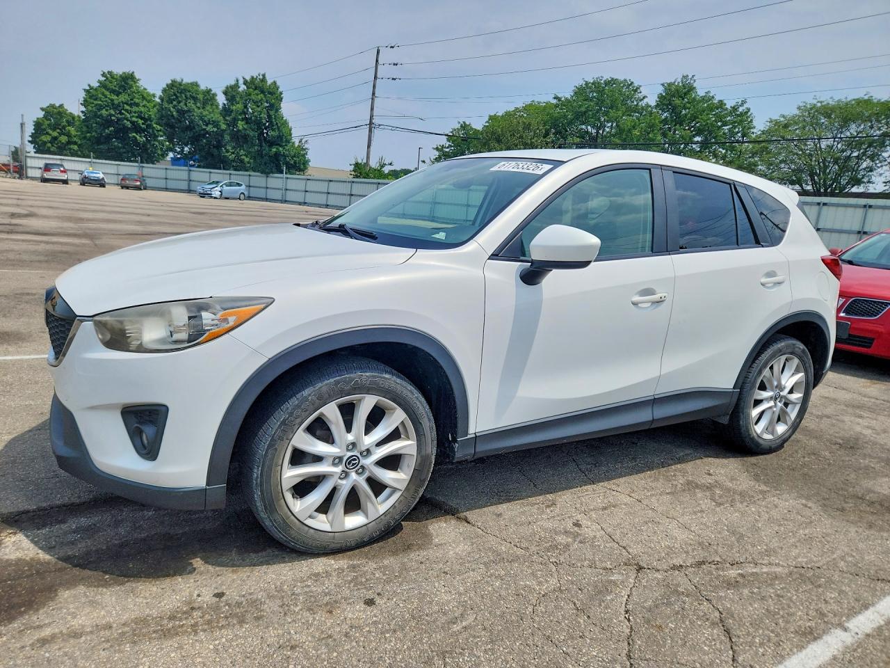 2013 Mazda CX-5 Grand Touring, VIN JM3KE4DEXD0134891 — Side