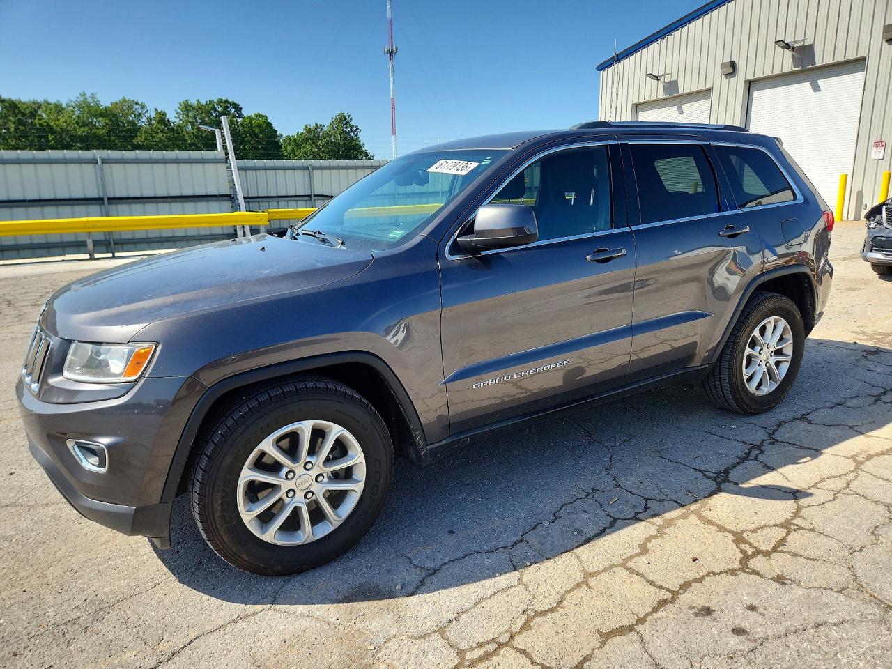 2015 Jeep Grand Cherokee Laredo, VIN 1C4RJEAG6FC681026 — Hail