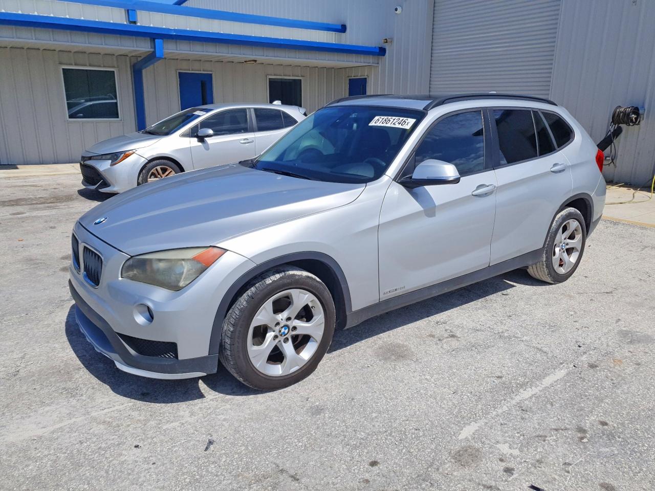 2015 BMW X1 sDrive28i, VIN WBAVM1C54FV316422 — Minor dents and scratches