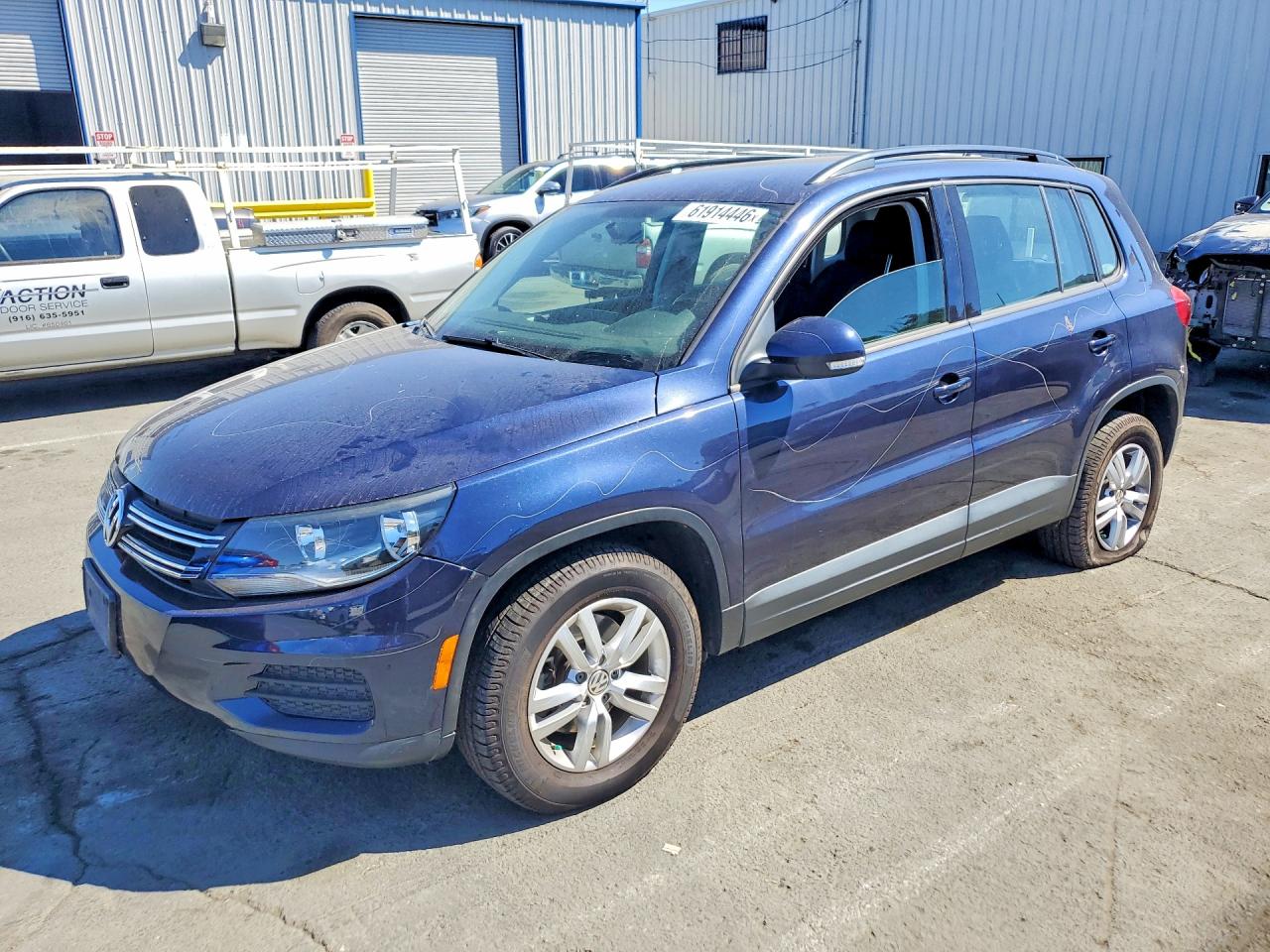 2015 Volkswagen Tiguan SEL, VIN WVGBV7AX1FW552834 — Vandalism