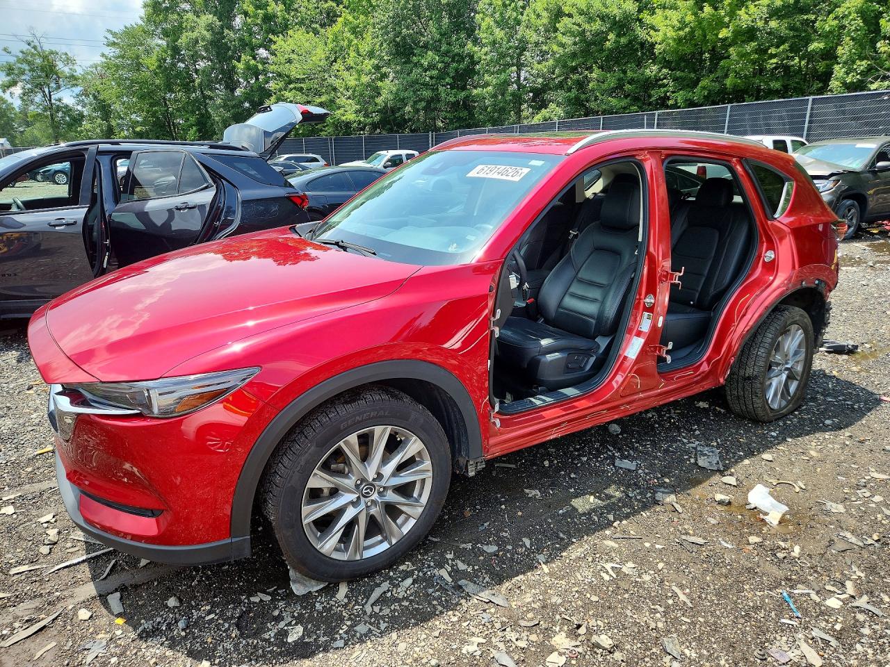 2021 Mazda CX-5 Grand Touring, VIN JM3KFADMXM0352316 — Side