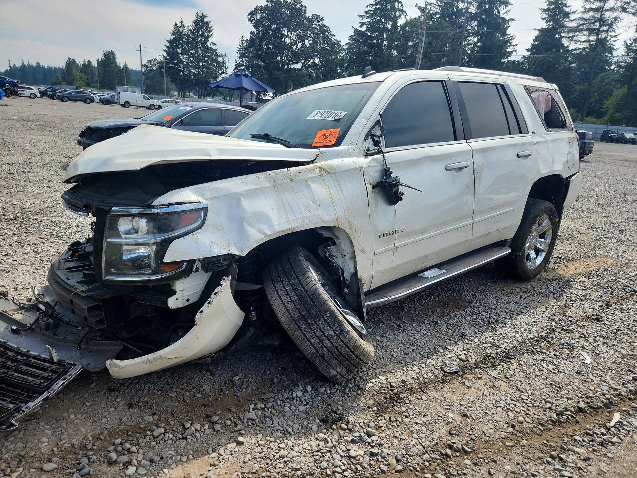 2015 Chevrolet Tahoe LTZ, VIN 1GNSKCKC7FR235583 — Rollover