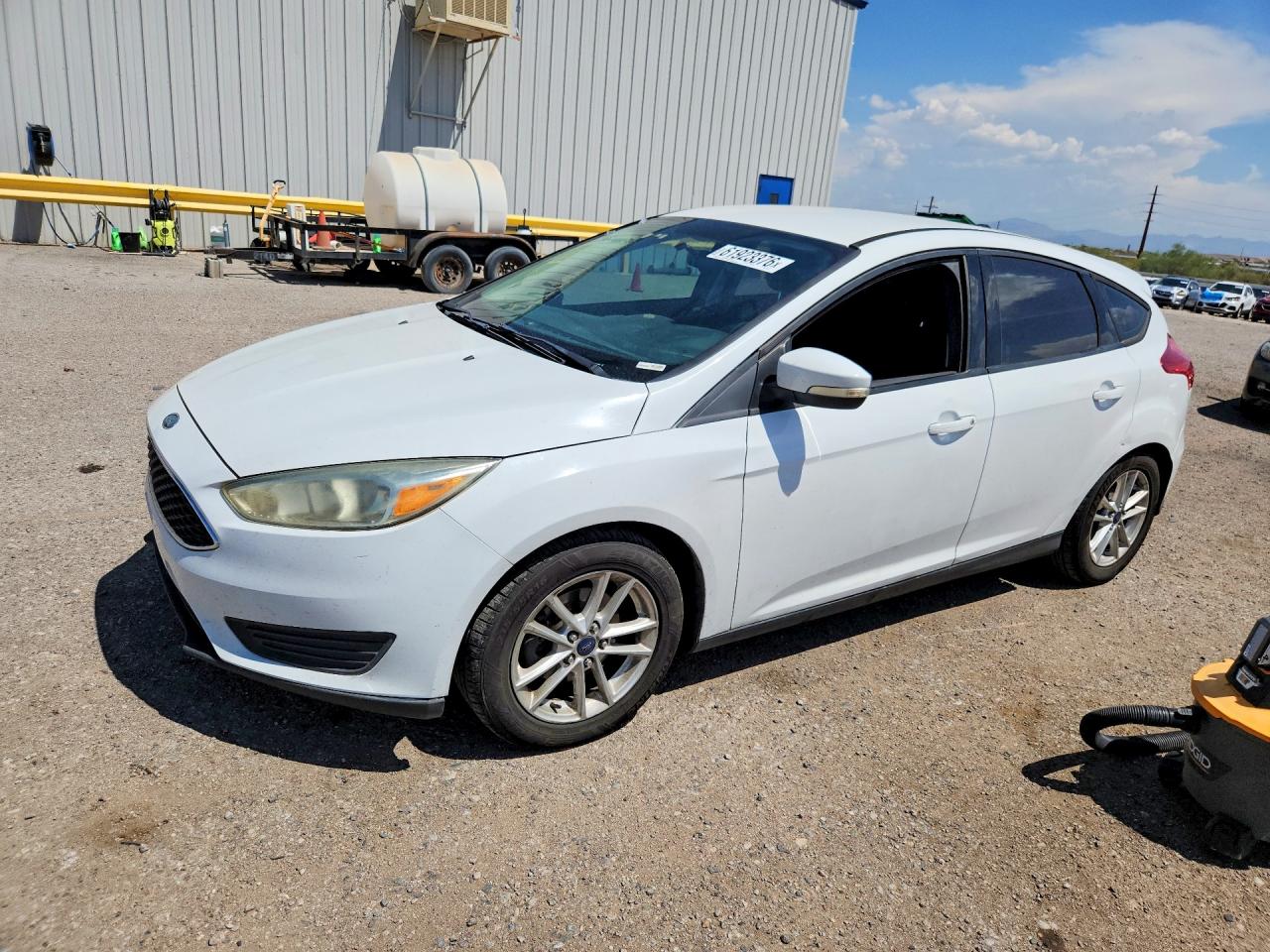 2016 Ford Focus SE, VIN 1FADP3K26GL379369 — Side