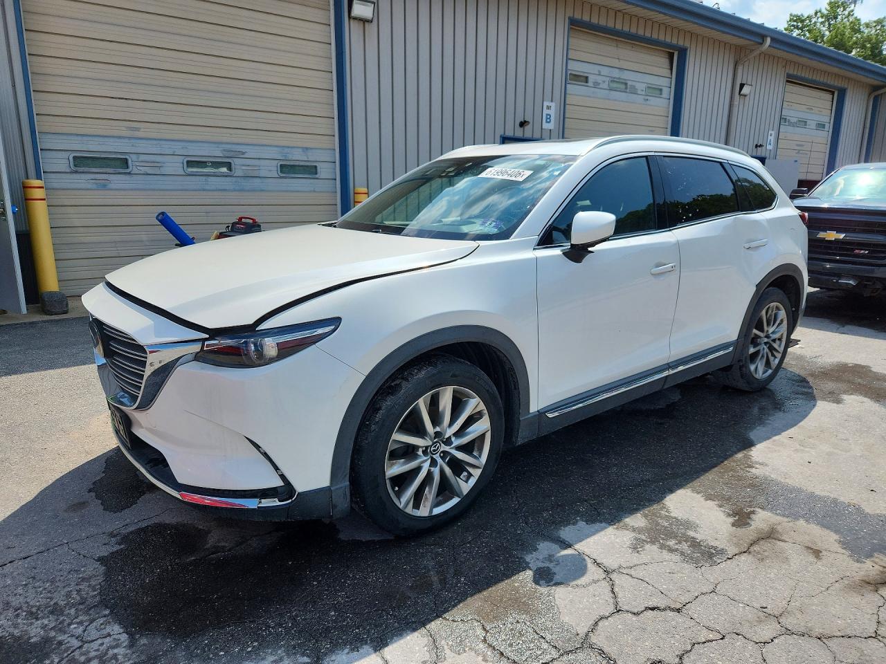 2016 Mazda CX-9 Grand Touring, VIN JM3TCBDY8G0122025 — Side