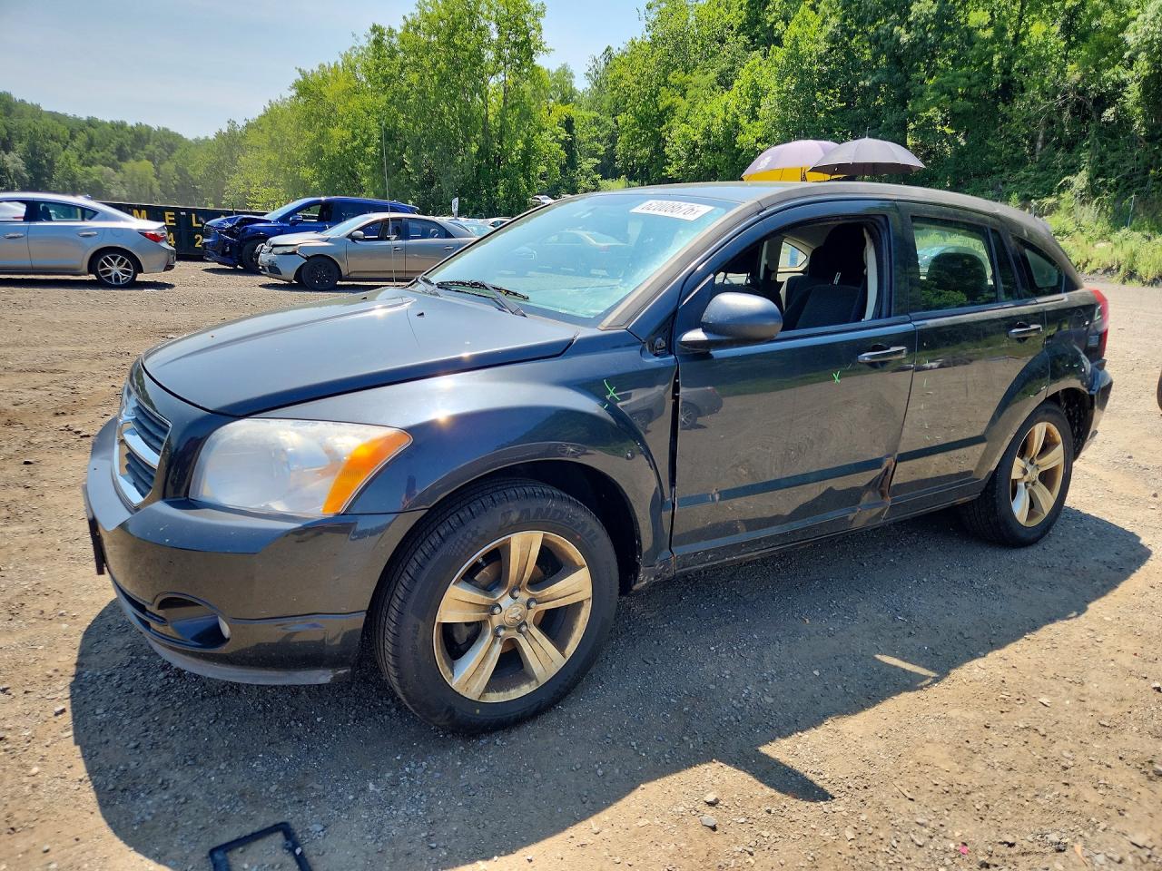 2010 Dodge Caliber Mainstreet, VIN 1B3CB3HA6AD672064 — Side